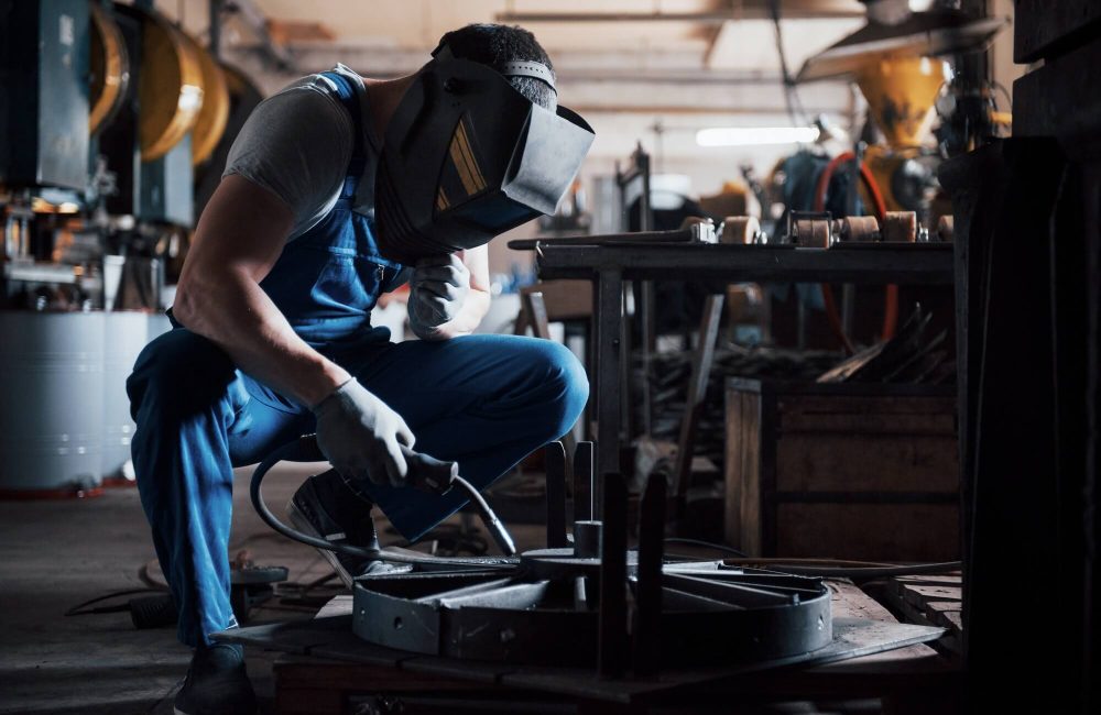 portrait-of-a-young-worker-at-a-large-metalworking-plant-the-welder-engineer-works-in-a-protective-1.jpg